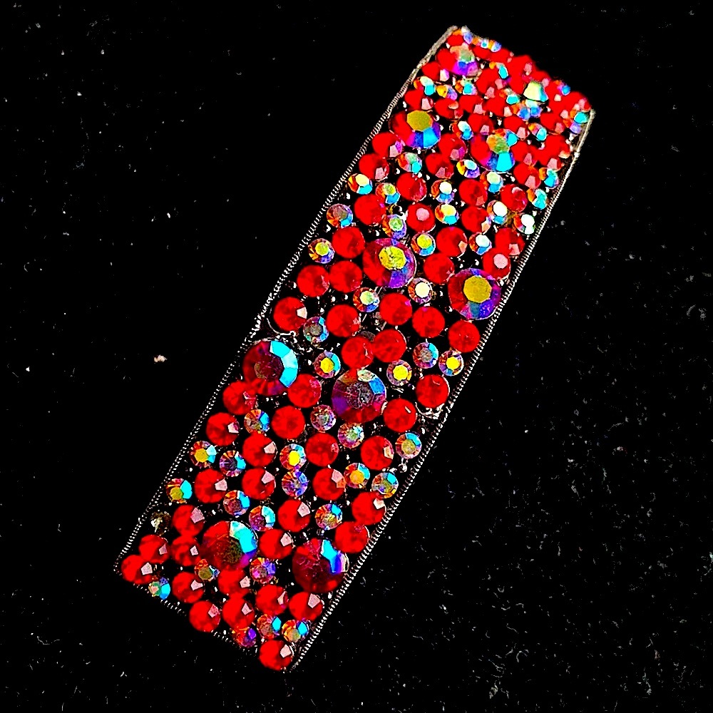 Nordstrom’s.  Cara N.Y iridescent, rhinestone red hair large clip.